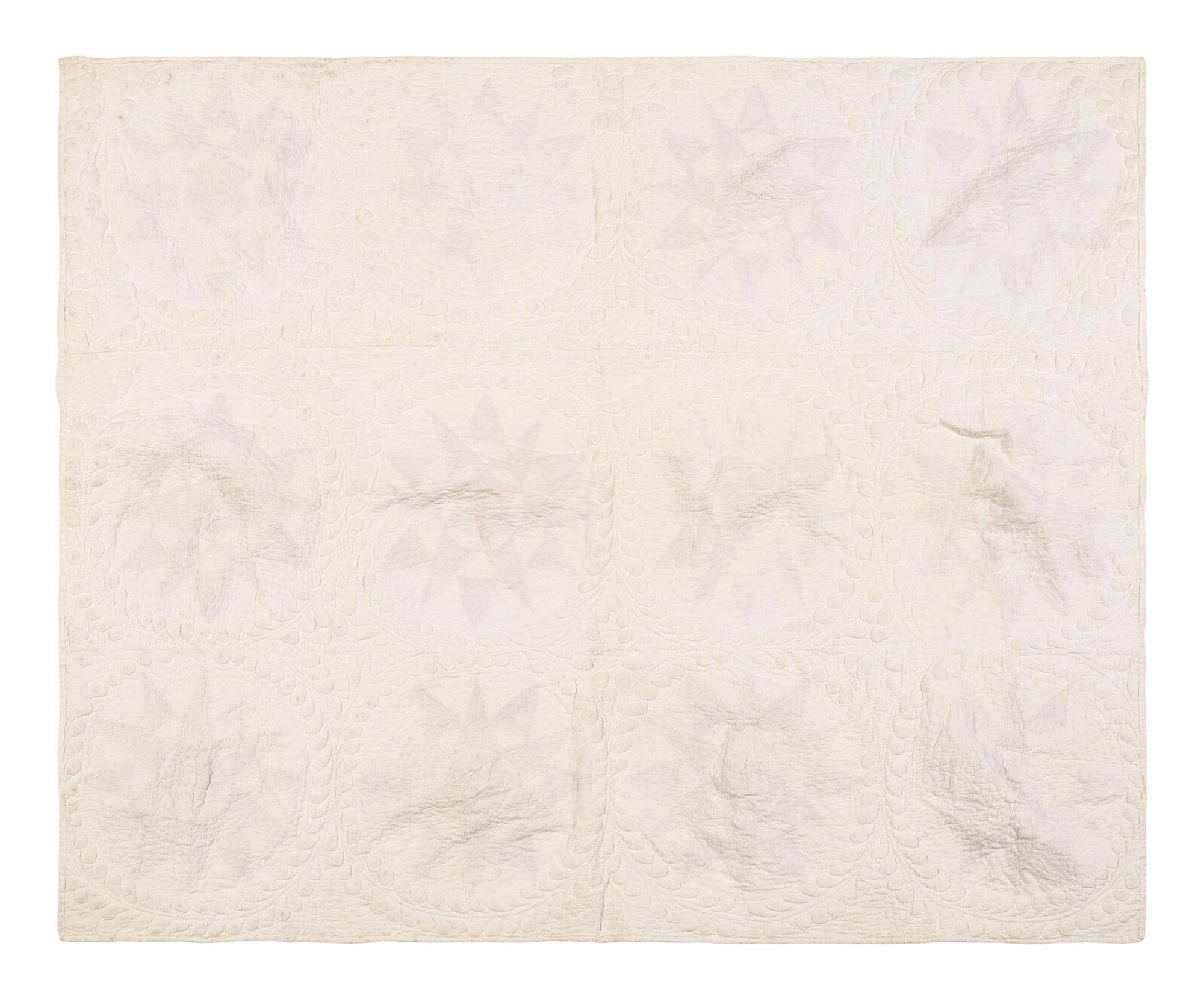 A Pieced and Trapunto Crib Quilt