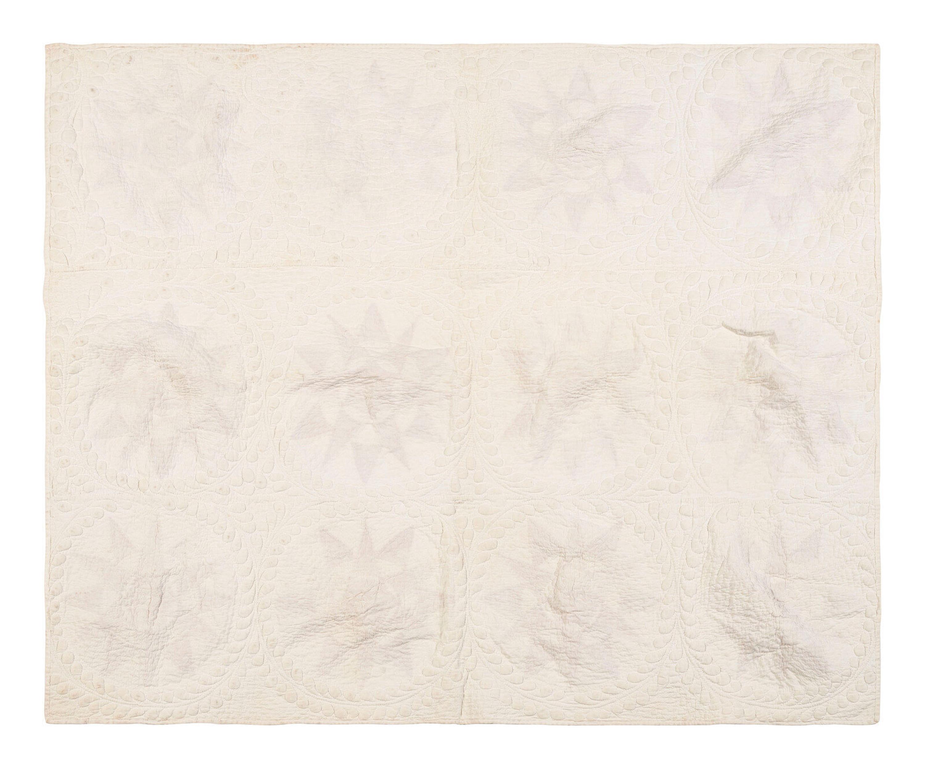 A Pieced and Trapunto Crib Quilt