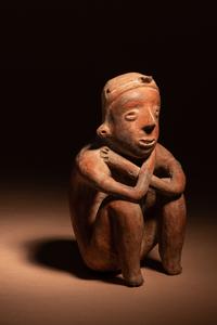 A Colima Terracotta Squatting Figure
