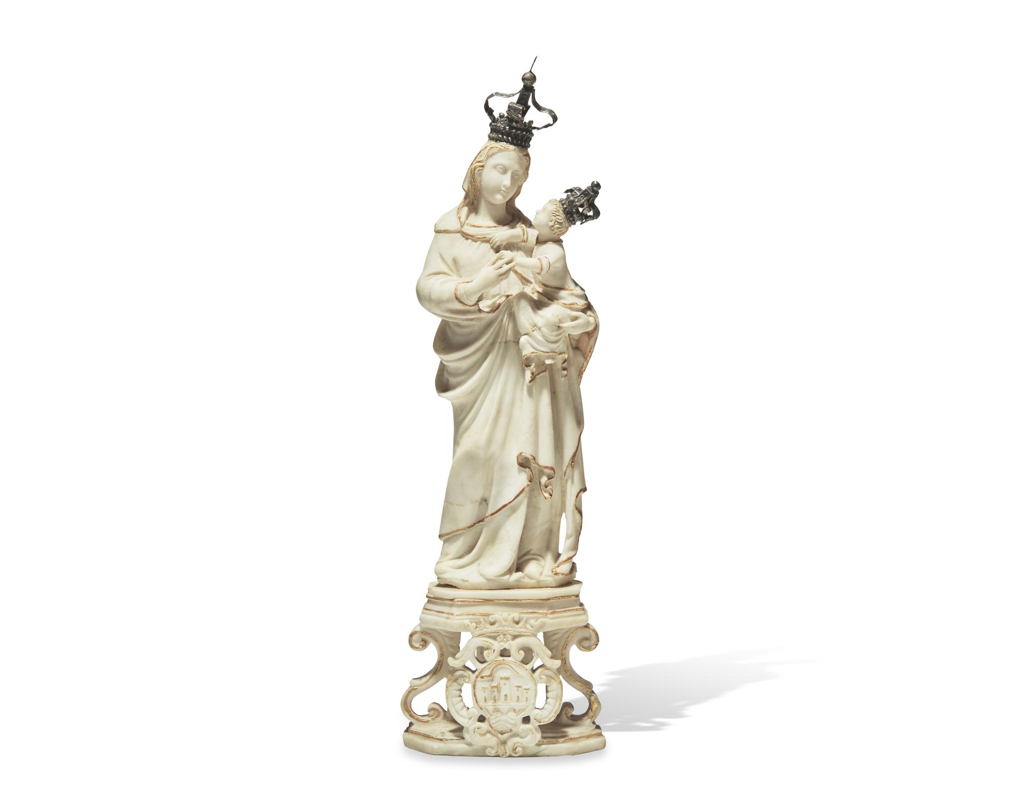 An Italian carved and parcel-gilt alabaster figure of the Madonna of Trapani, Sicily, 18th century, displayed in carved walnut and glass reliquary box, likely 19th century