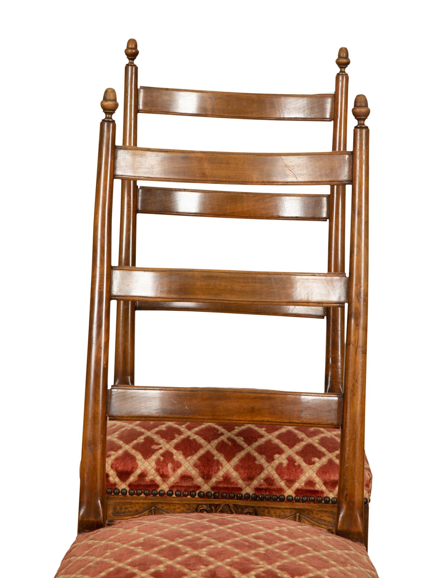 A Set of Six French Provincial Carved Walnut Dining Chairs