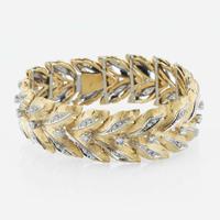 An 18K bicolor gold and diamond link bracelet