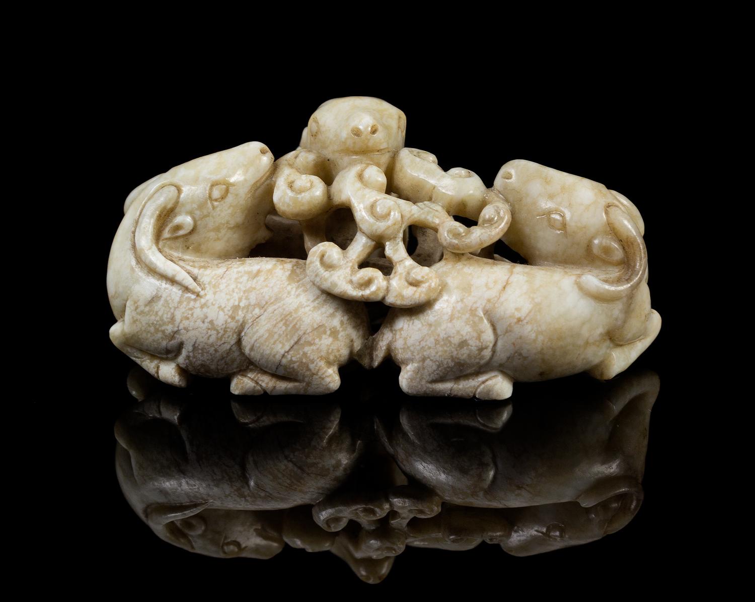 A Chinese Chicken-Bone Jade Figural Group 17TH/18TH CENTURY Length 2 1/2 x height 1 1/4 inches. — 17TH/18TH CENTURY