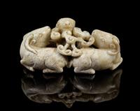 A Chinese Chicken-Bone Jade Figural Group 17TH/18TH CENTURY Length 2 1/2 x height 1 1/4 inches. — 17TH/18TH CENTURY