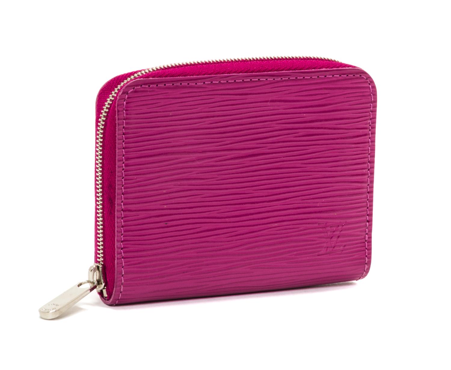 A Louis Vuitton Fuschia Epi Zippy Coin Purse, 4.3"x 3.3" x 0.8".
