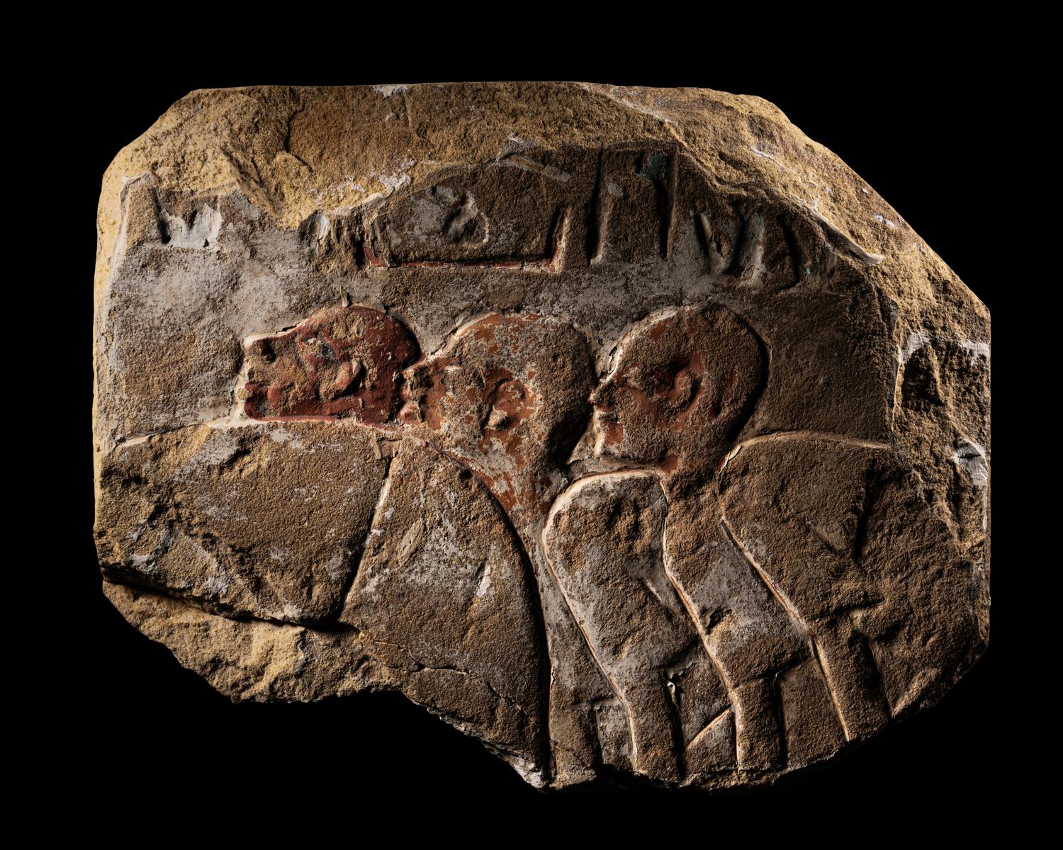 An Egyptian Painted Sandstone Relief Fragment