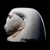 An Egyptian Limestone Canopic Jar Lid