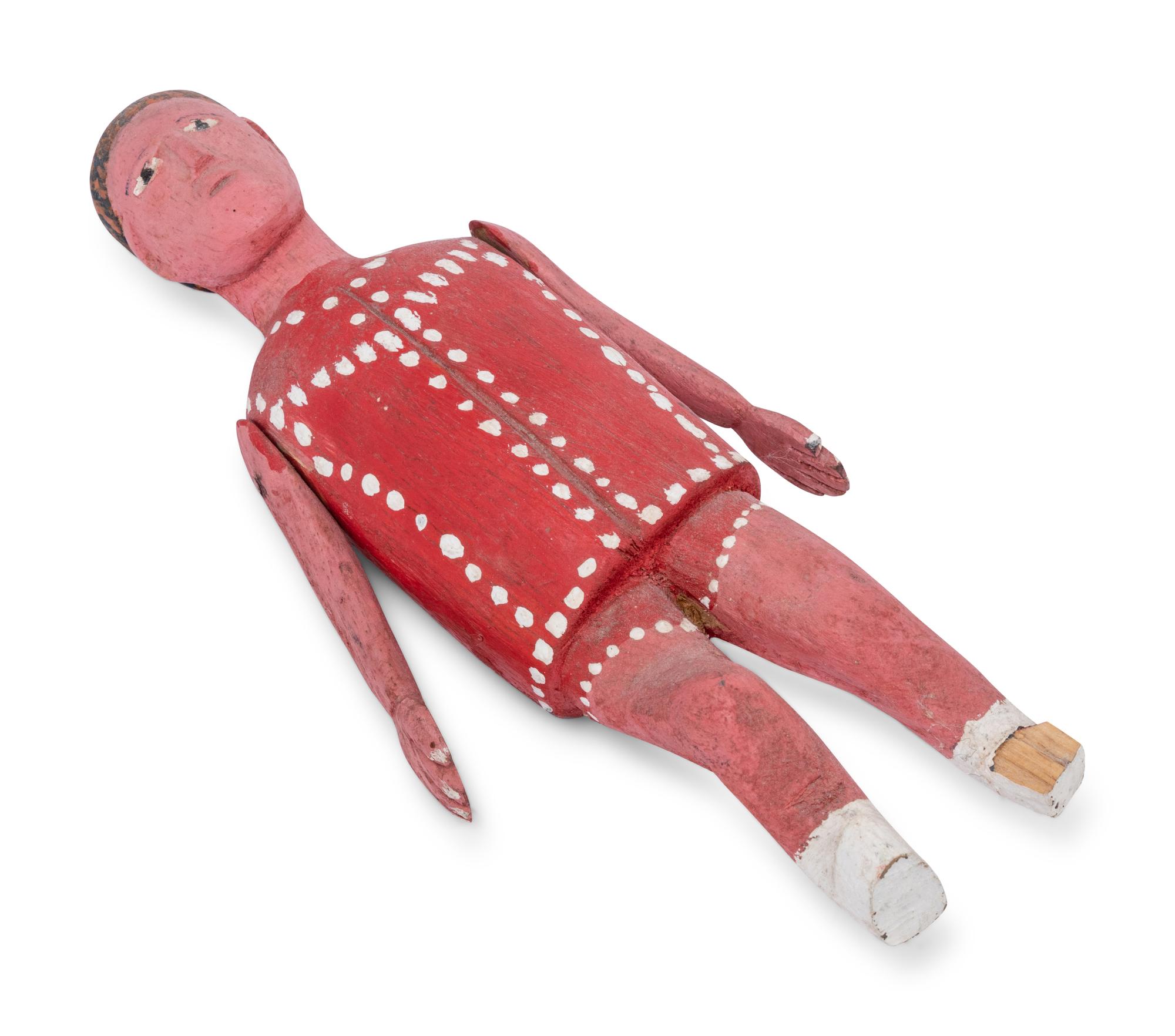 A Red Painted Wooden Figure