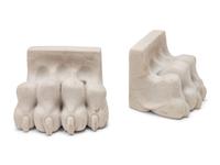 A Pair of Composition and Bronze Paw and Foot Form Doorstops