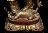 A Large Gilt and Red Lacquered Wood Figure of a Dancing Deity