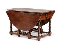A William and Mary Walnut Drop-Leaf Table Height 30 1/2 x width 30 x depth 52 1/2 inches. — 18TH CENTURY