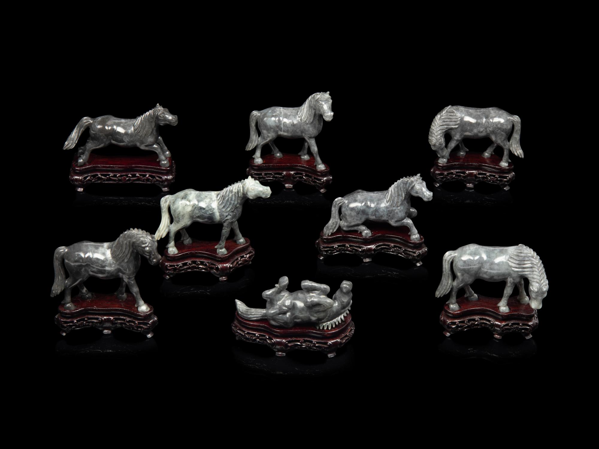 A Small Set of Eight Grey Jadeite Figures of Horses