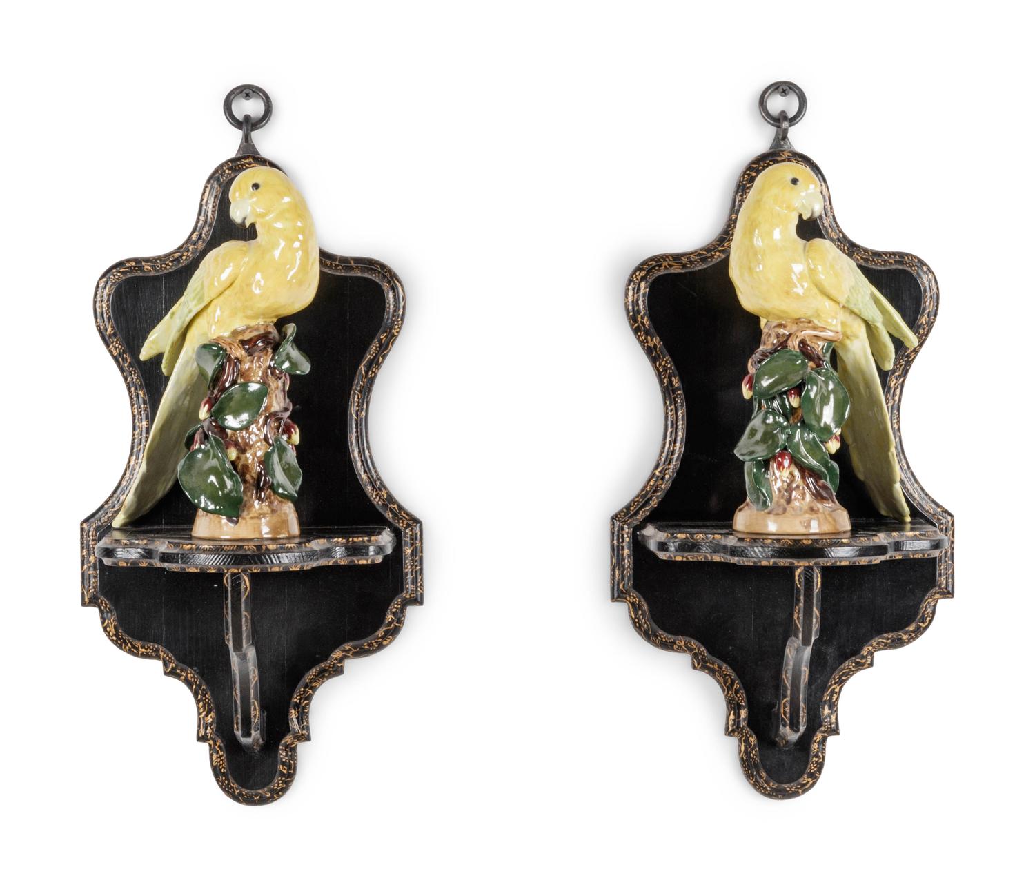 A Pair of Continental Porcelain Parrots with Parcel Gilt and Ebonized Wall Brackets