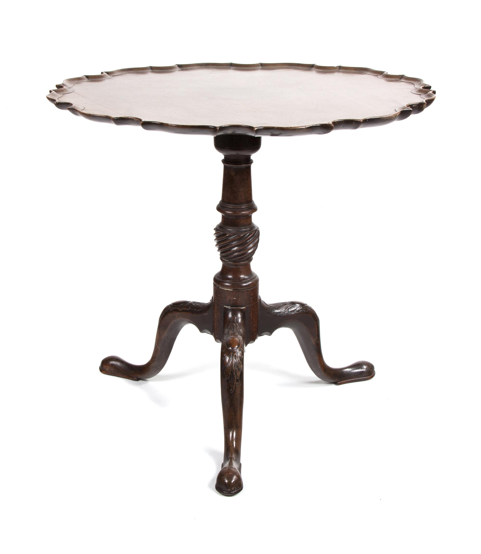 A Chippendale Style Mahogany Tilt Top Table Height 29 1/2 x diameter 29 3/4 inches. — 19TH CENTURY