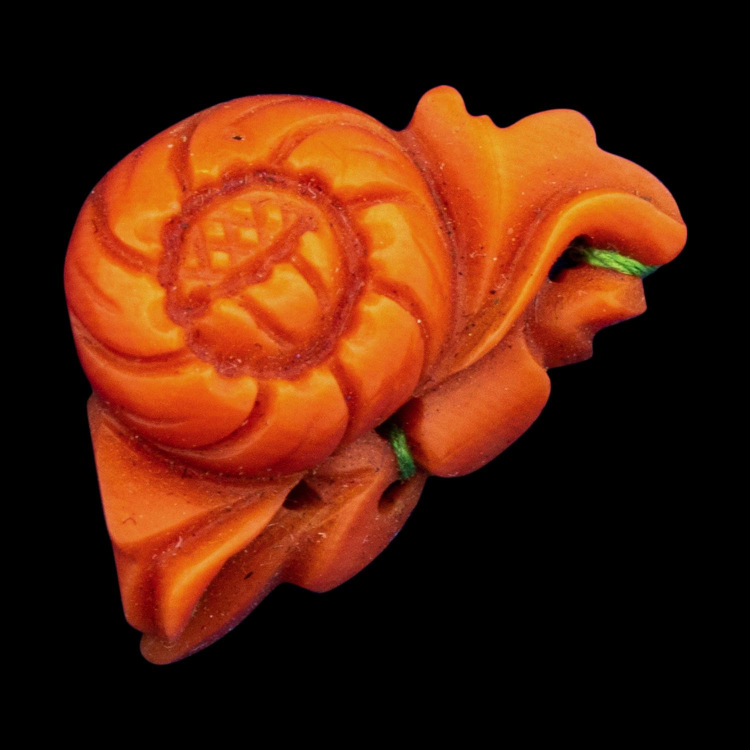 A Group of Chinese Red Carnelian and Coral Pendants