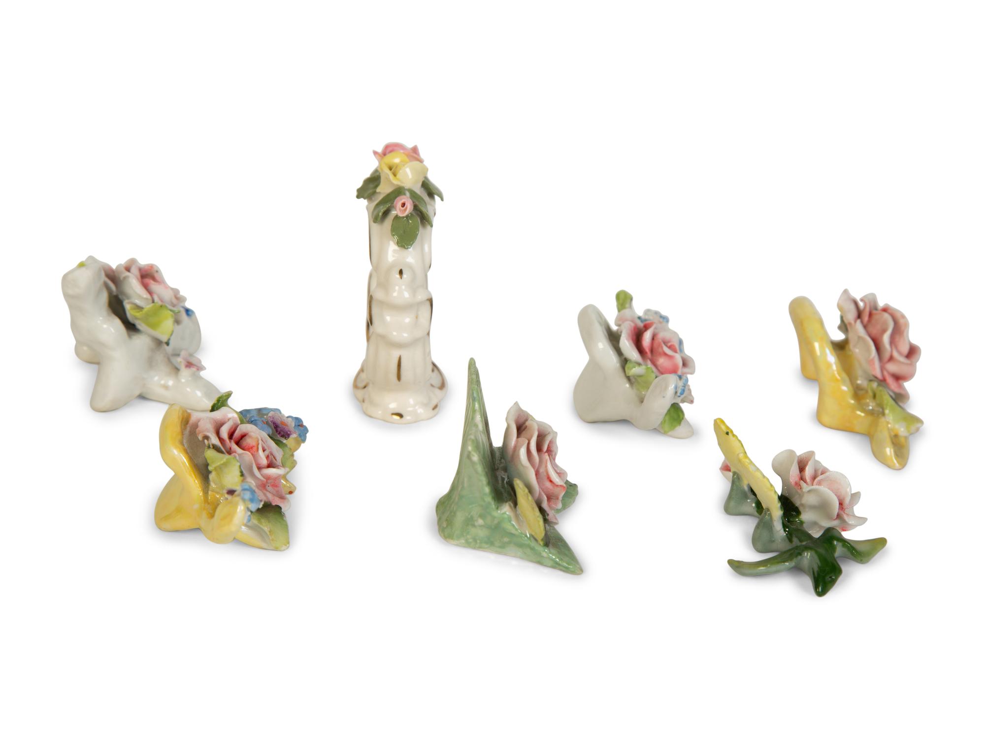 A Collection of Dresden Porcelain Place Cards, Holders and Napkin Rings