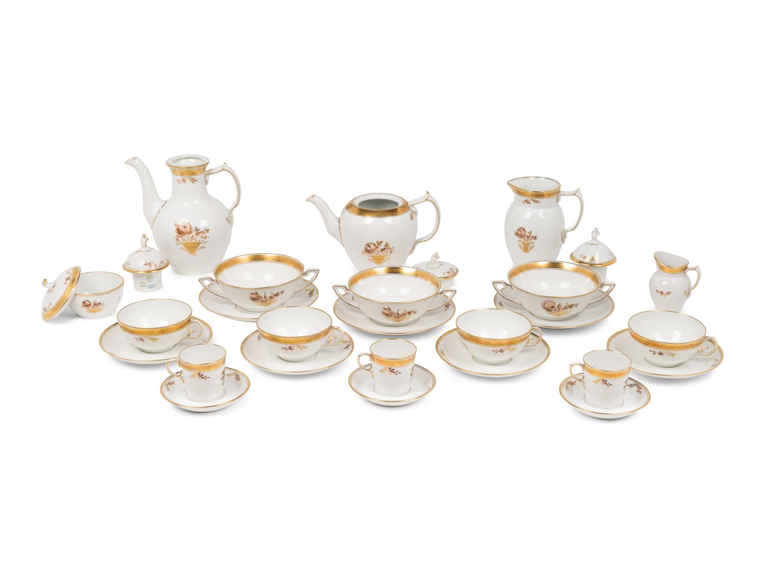 A Royal Copenhagen Golden Basket Porcelain Dinner Service
