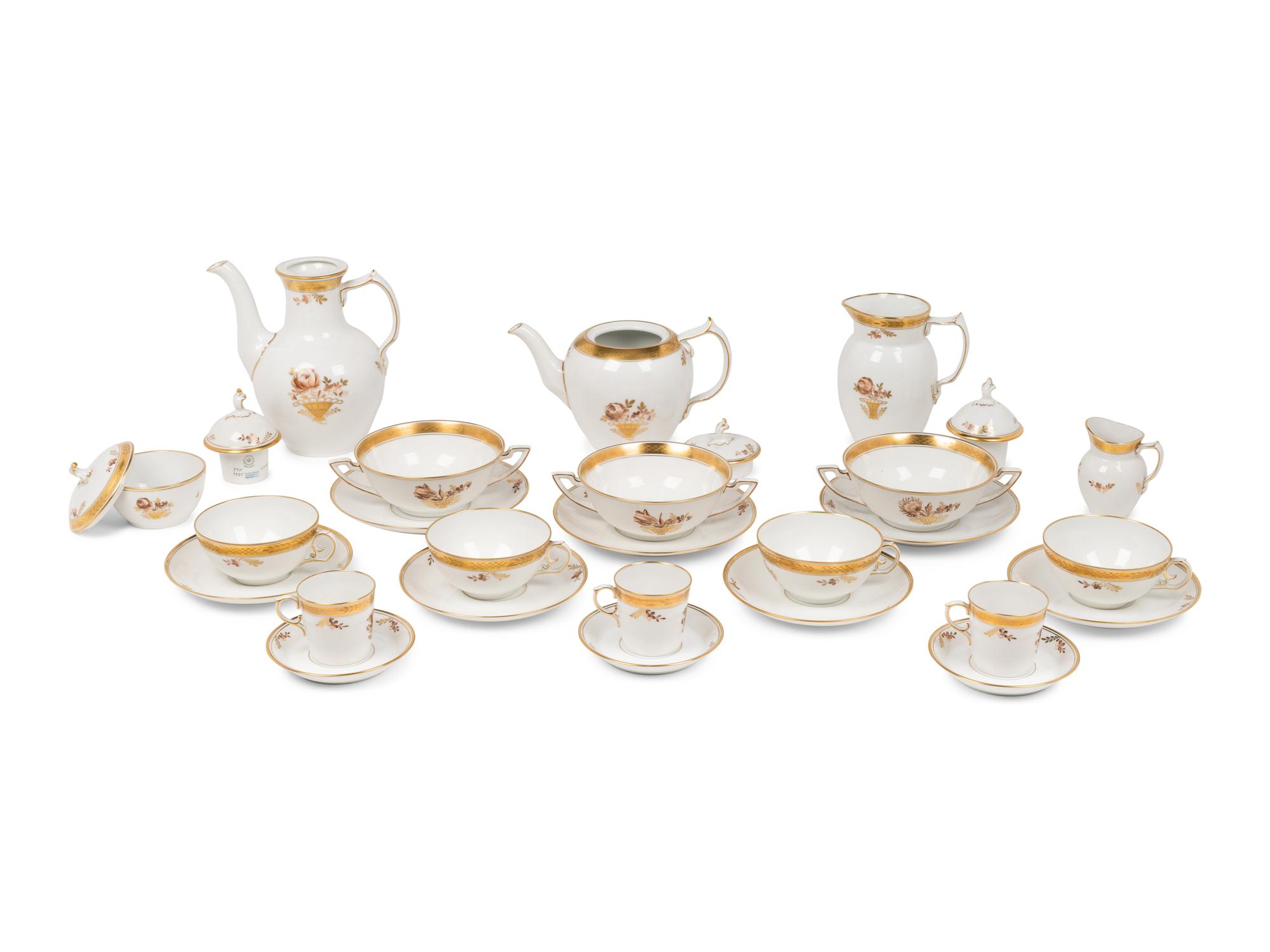 A Royal Copenhagen Golden Basket Porcelain Dinner Service