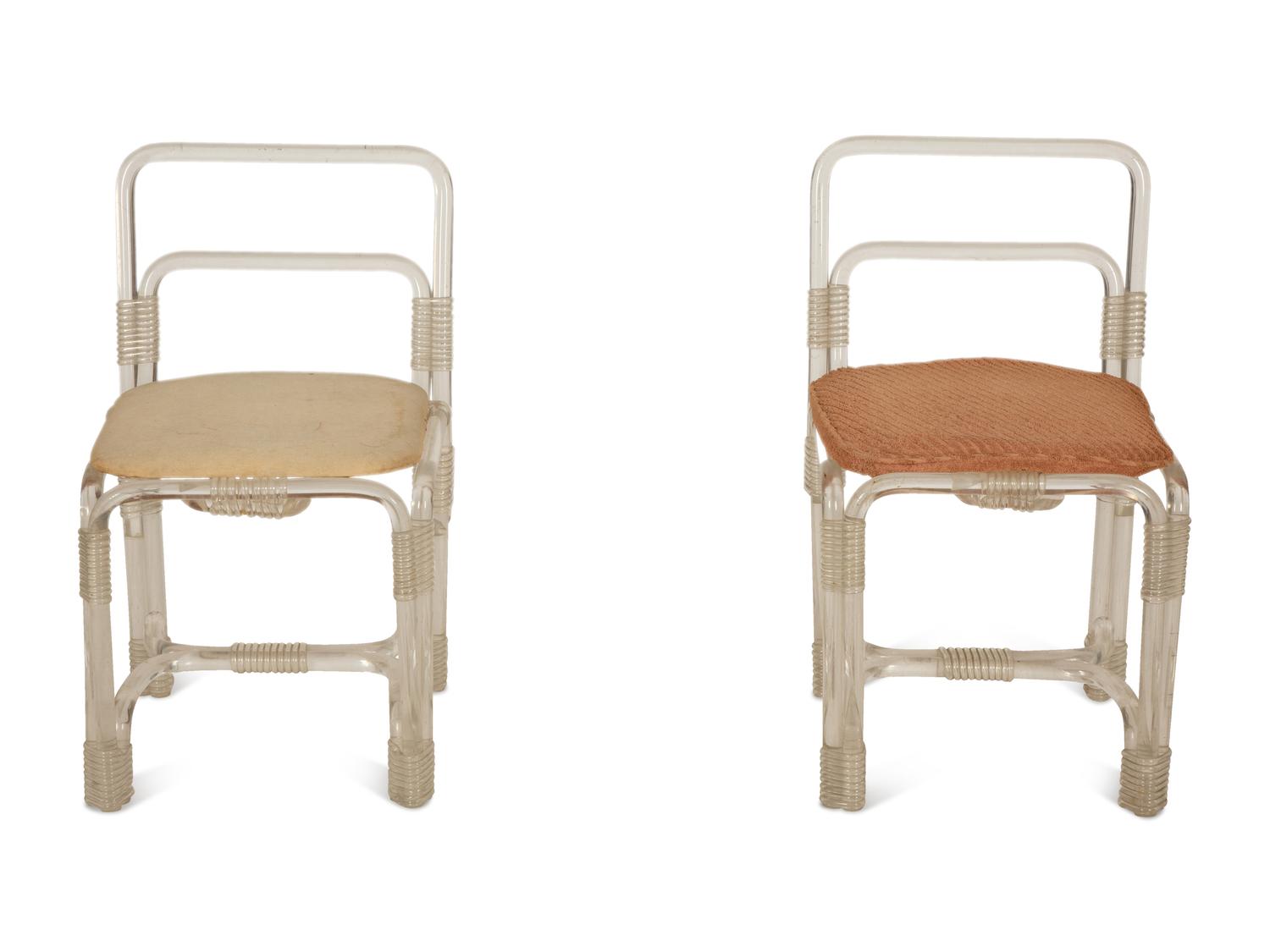 A Pair of Tubular Acrylic Low Back Chairs