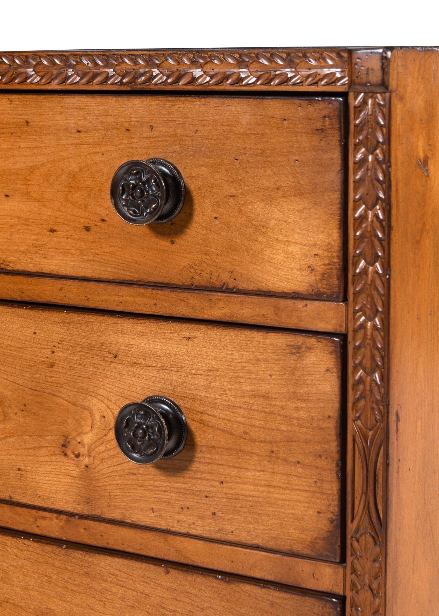 A Contemporary Carved Walnut Chest of Drawers