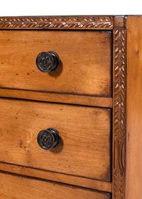 A Contemporary Carved Walnut Chest of Drawers