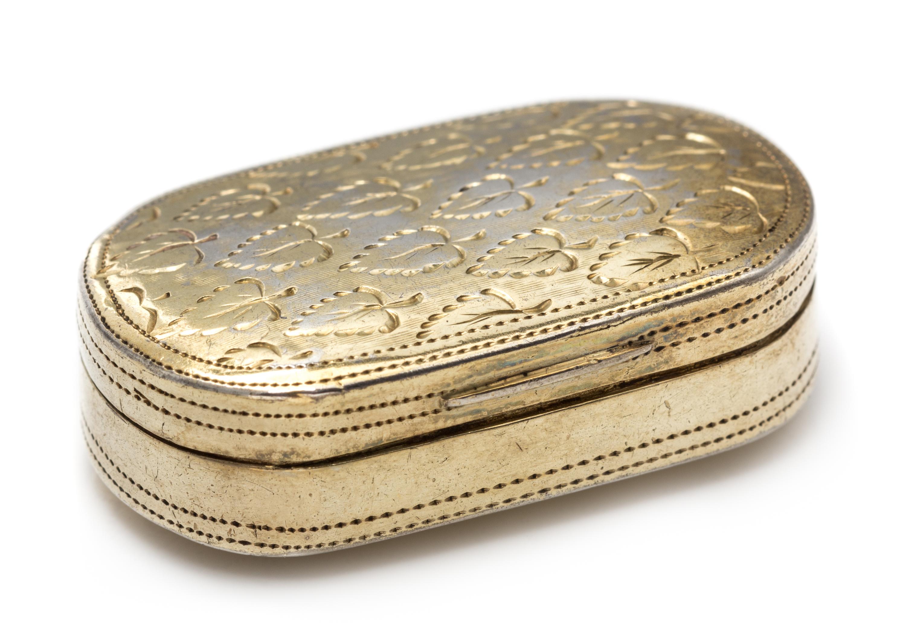 A George III Silver-Gilt Vinaigrette, Likely Samuel Pemberton, Birmingham, 1802, the lid engraved with foliate decoration.