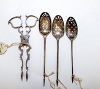 A Collection of Georgian Silver Table Articles, various makers, comprising three olive spoons with obscured marks and a pair of sugar n