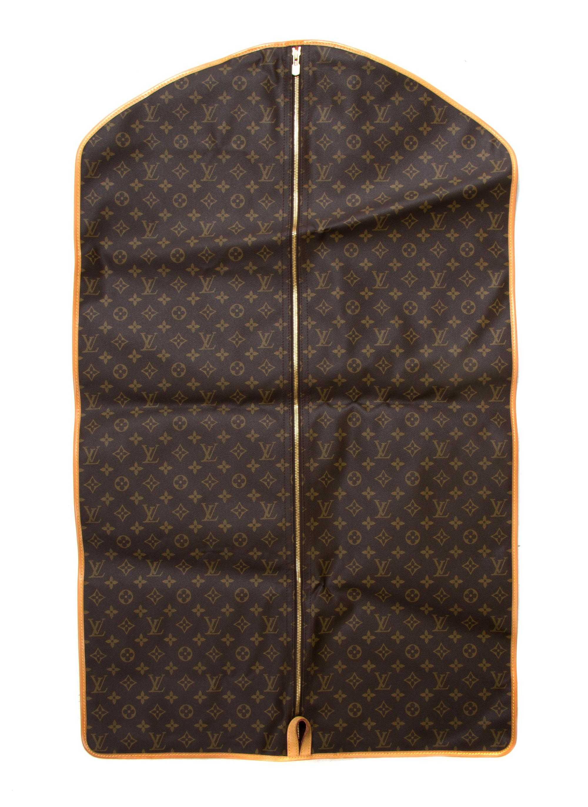 A Louis Vuitton Monogram Canvas Keepall 45 Bag and Garment Bag, 18 x 9 x 8 inches.