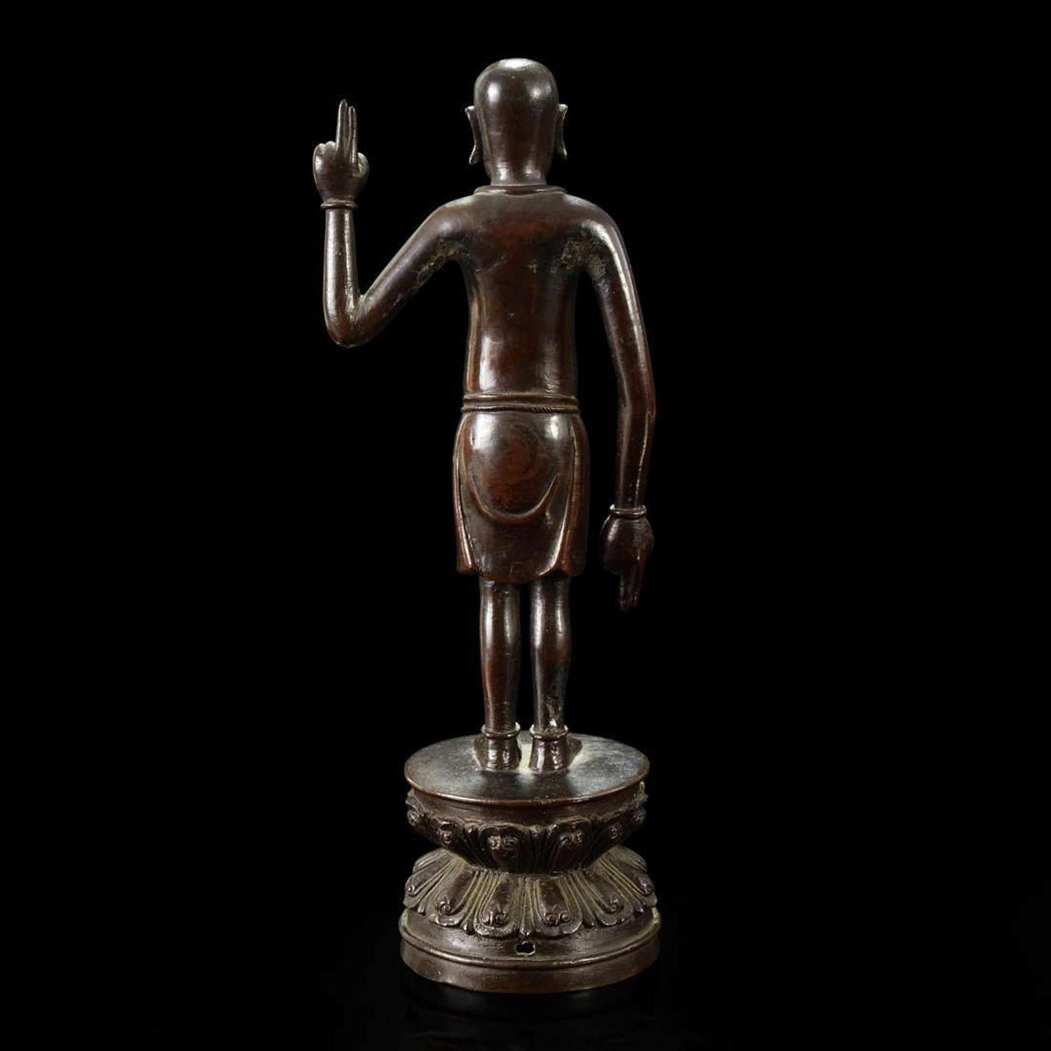 A Chinese bronze figure of the infant Buddha Ming dynasty