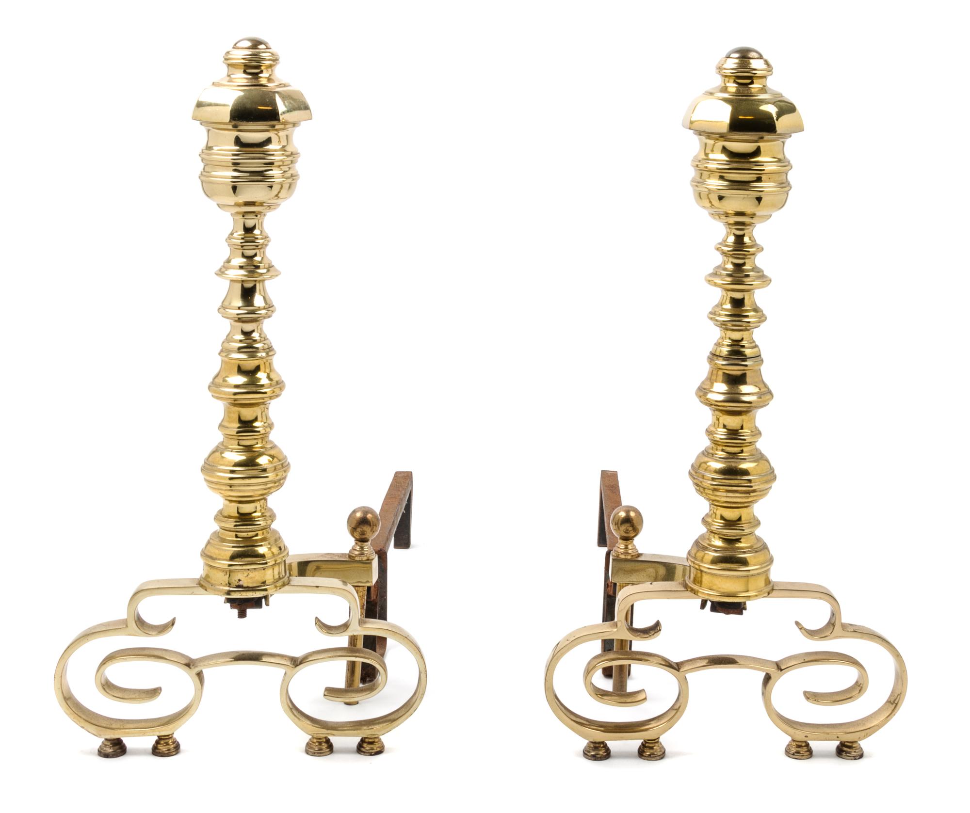 A Pair of Brass Andirons and an Associated Fender Height of andirons 22 1/4 inches. — 20TH CENTURY