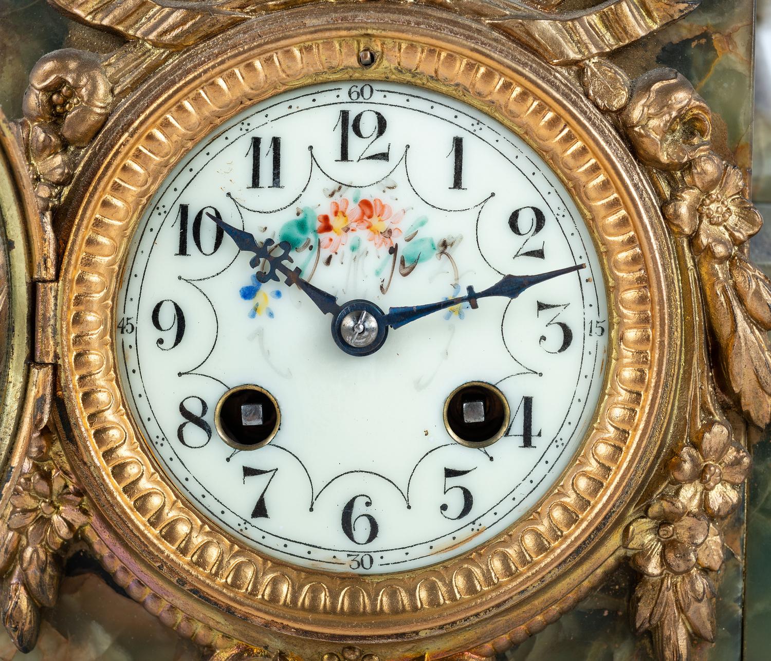 A Neoclassical Gilt Metal and Onyx Clock Garniture
