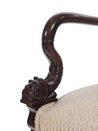 A Pair of Directoire Style Carved Walnut Fauteuils
