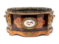 A French Porcelain and Gilt Bronze Mounted Kingwood Jardinière