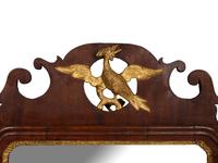 A Chippendale Style Carved and Parcel Gilt Mahogany Looking Glass