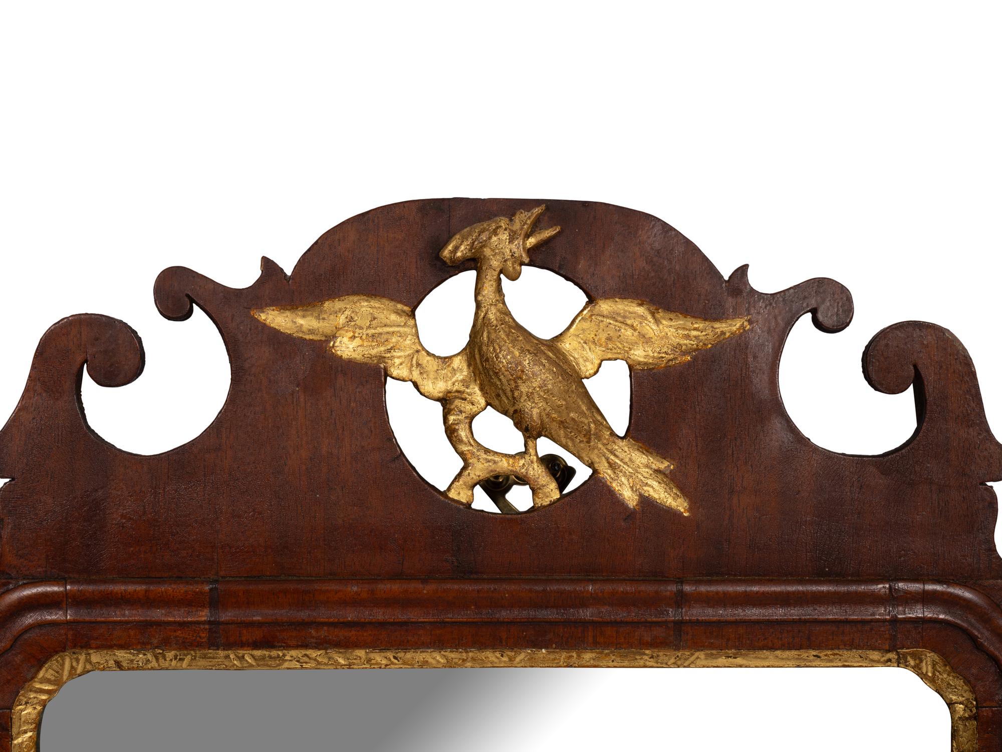 A Chippendale Style Carved and Parcel Gilt Mahogany Looking Glass