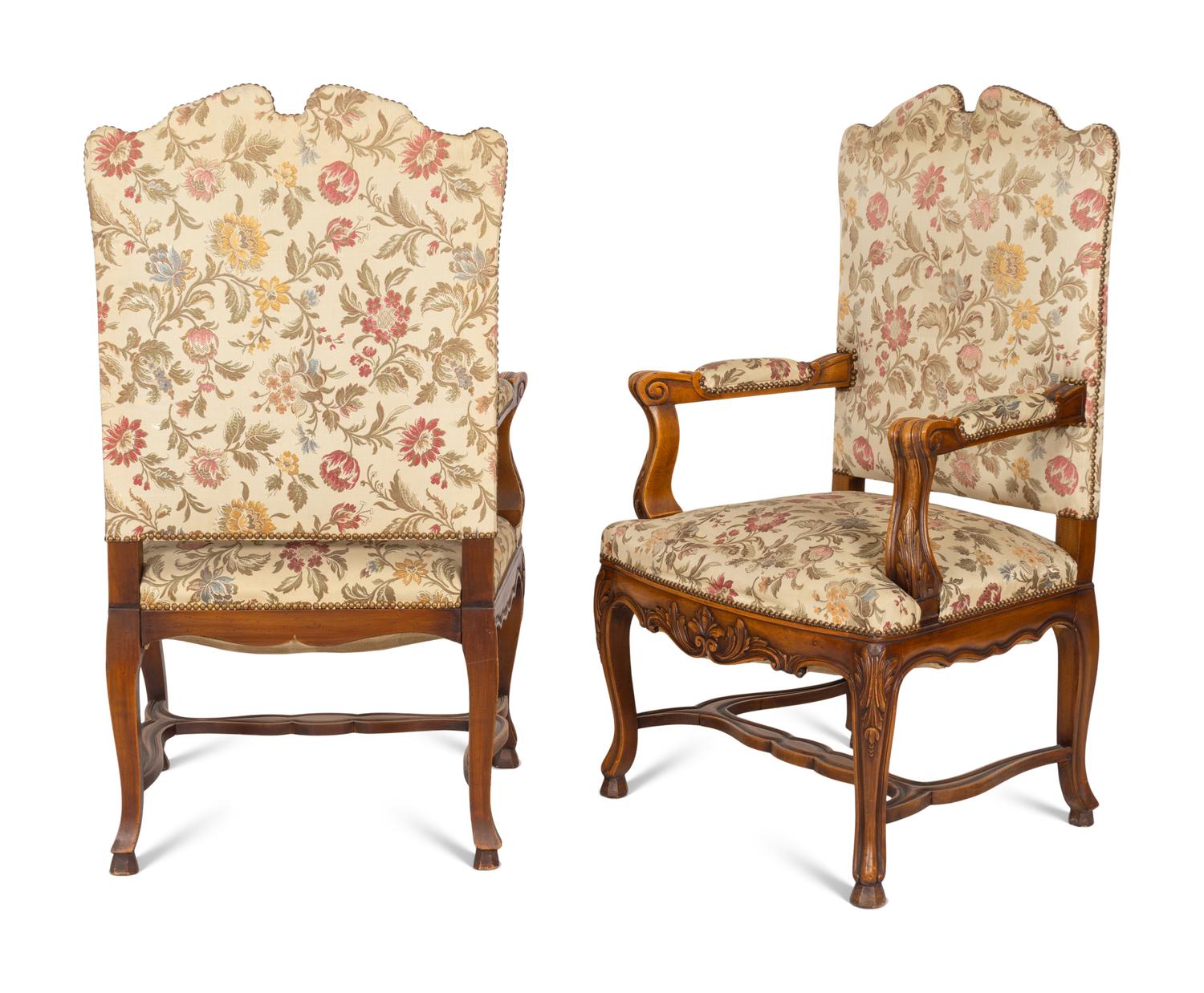 A Set of Six Régence Style Carved Walnut Fauteuils