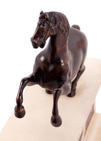 An Italian Bronze Model of a Horse on a White Marble and Porphyry Base