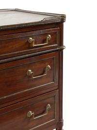 A Directoire Gilt Bronze Mounted Mahogany and Marble-Top Commode