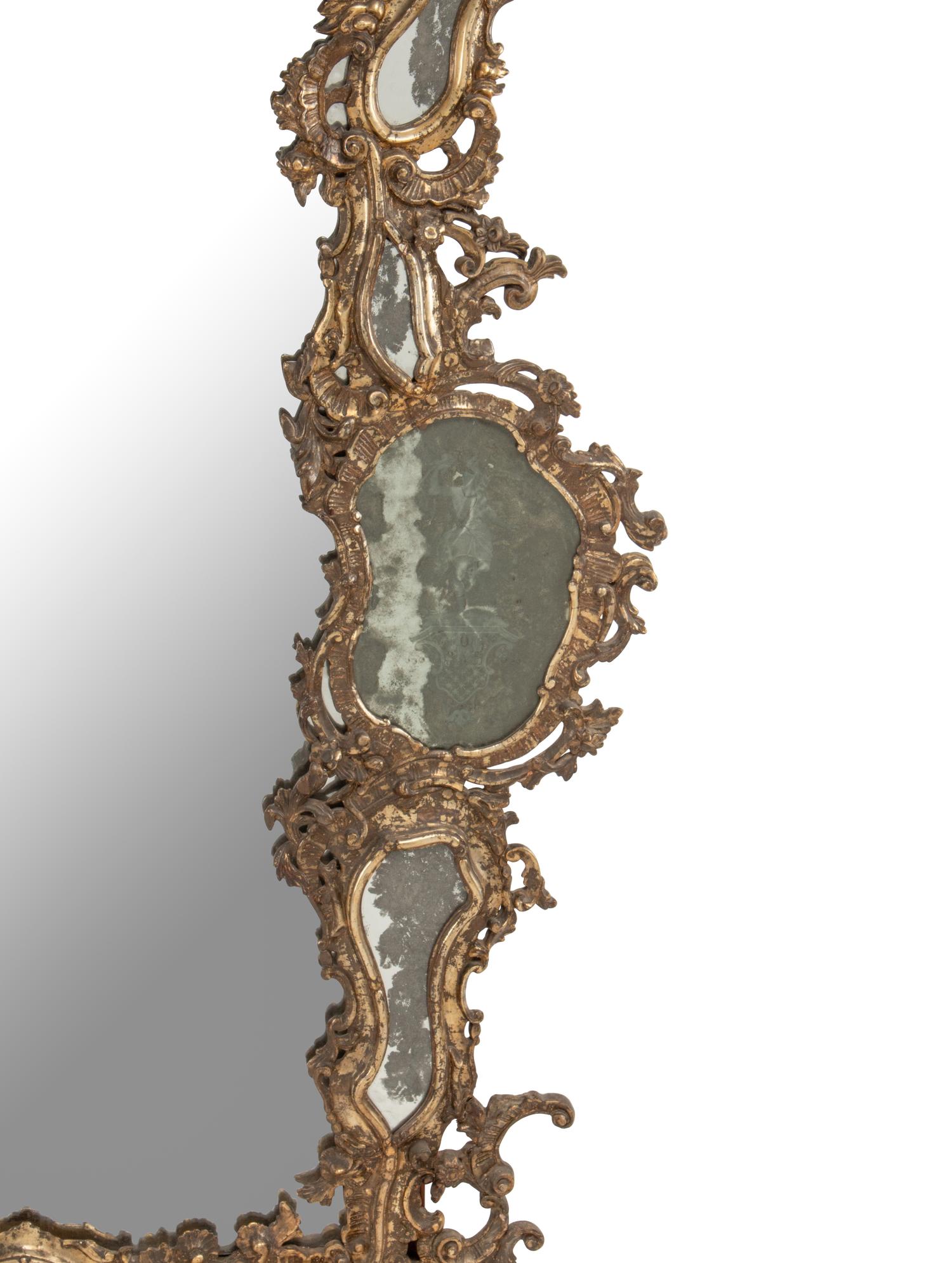 An Italian Silvered Wood and Etched Glass Mirror