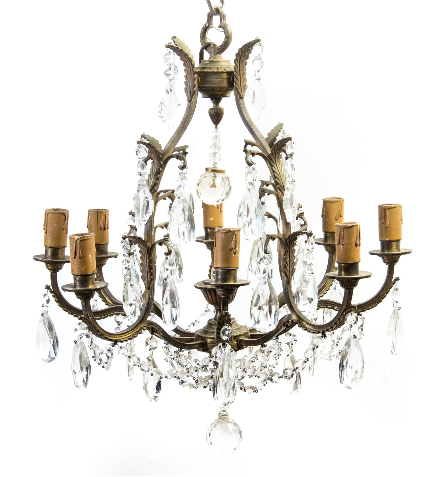 A Louis XVI Style Bronze and Cut Glass Nine-Light Chandelier, Height 24 x diameter 24 inches.
