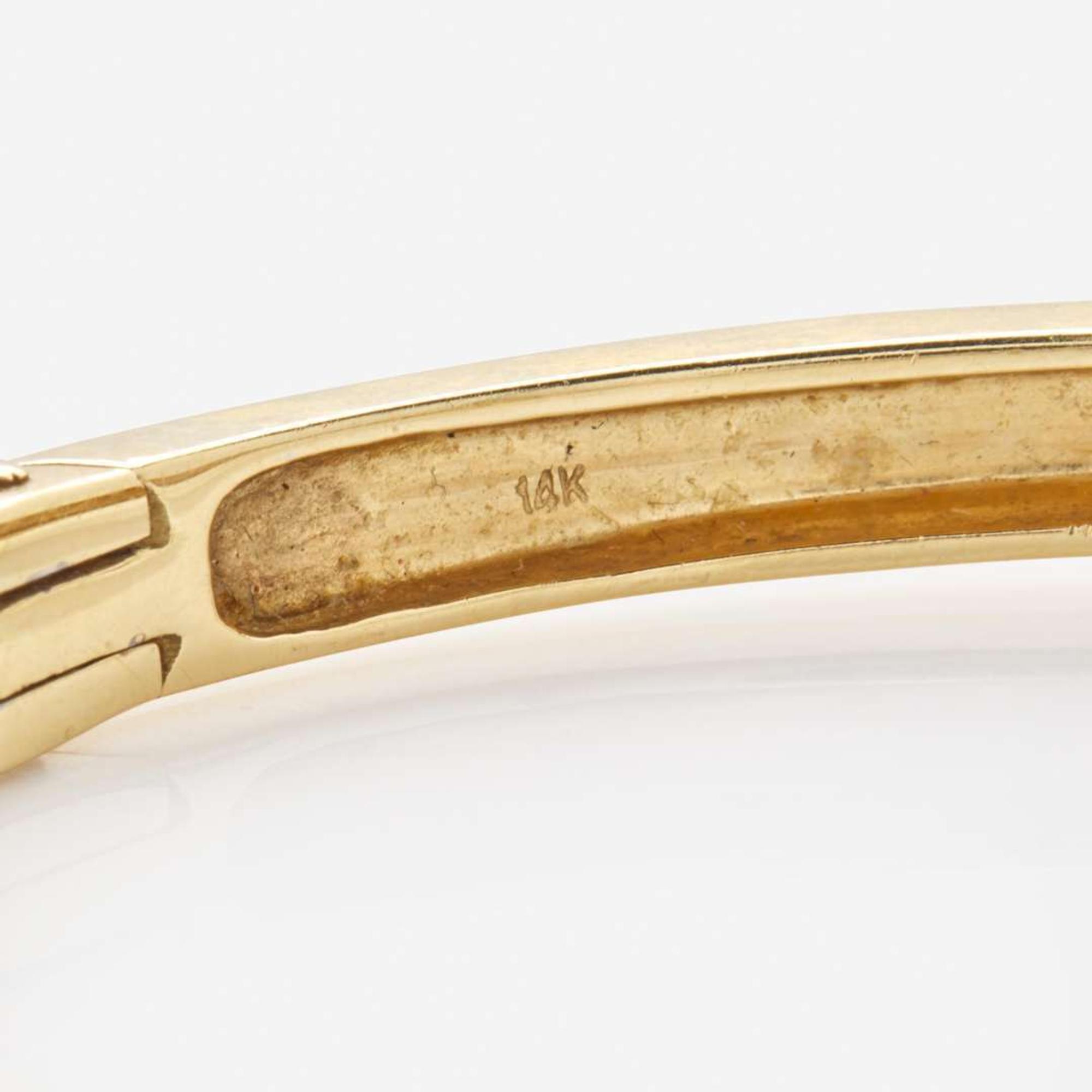 A 14K Yellow Gold and Diamond Bangel