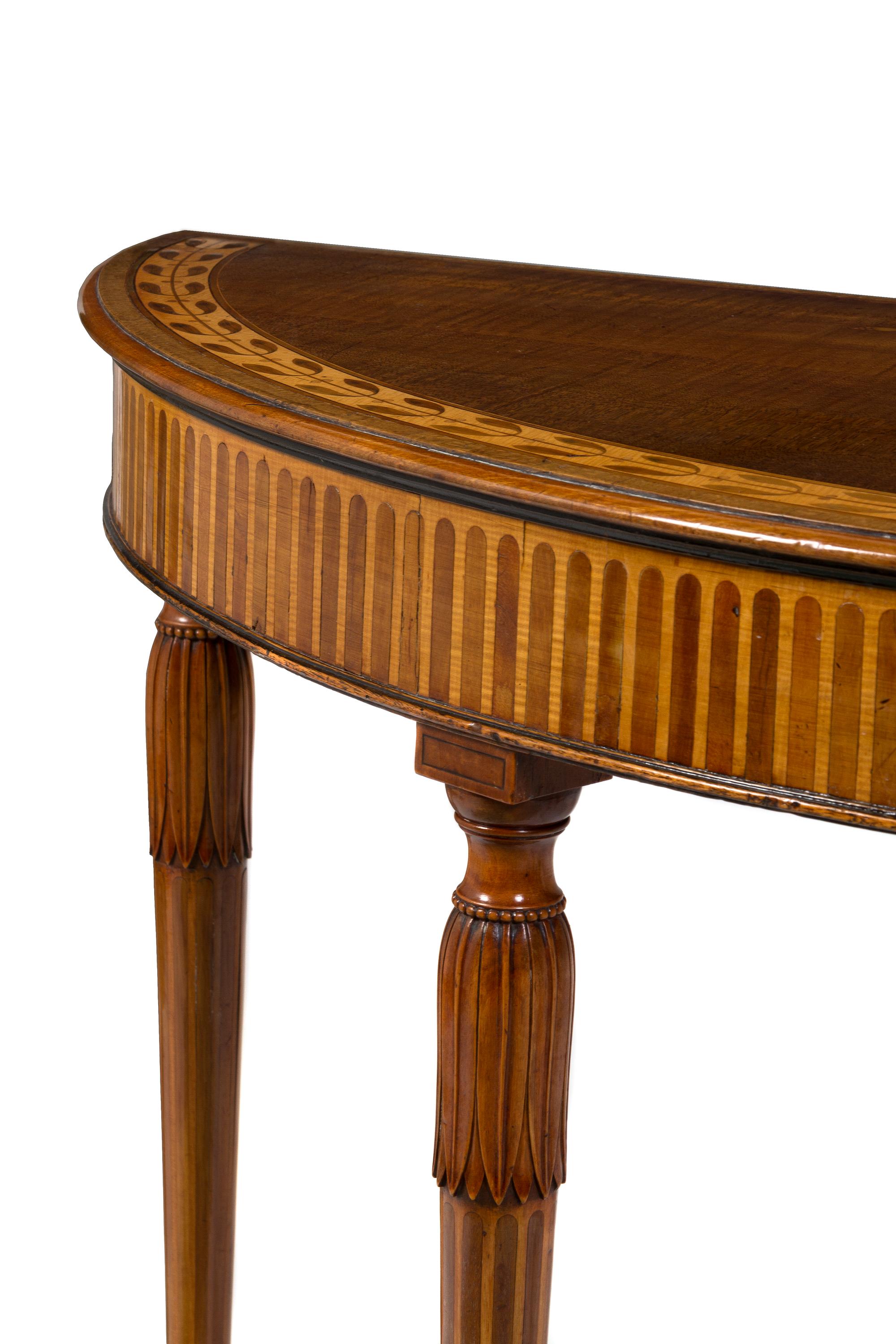 A Hepplewhite Sycamore Marquetry Console Table, Height 32 x width 47 3/4 x depth 17 5/8 inches.