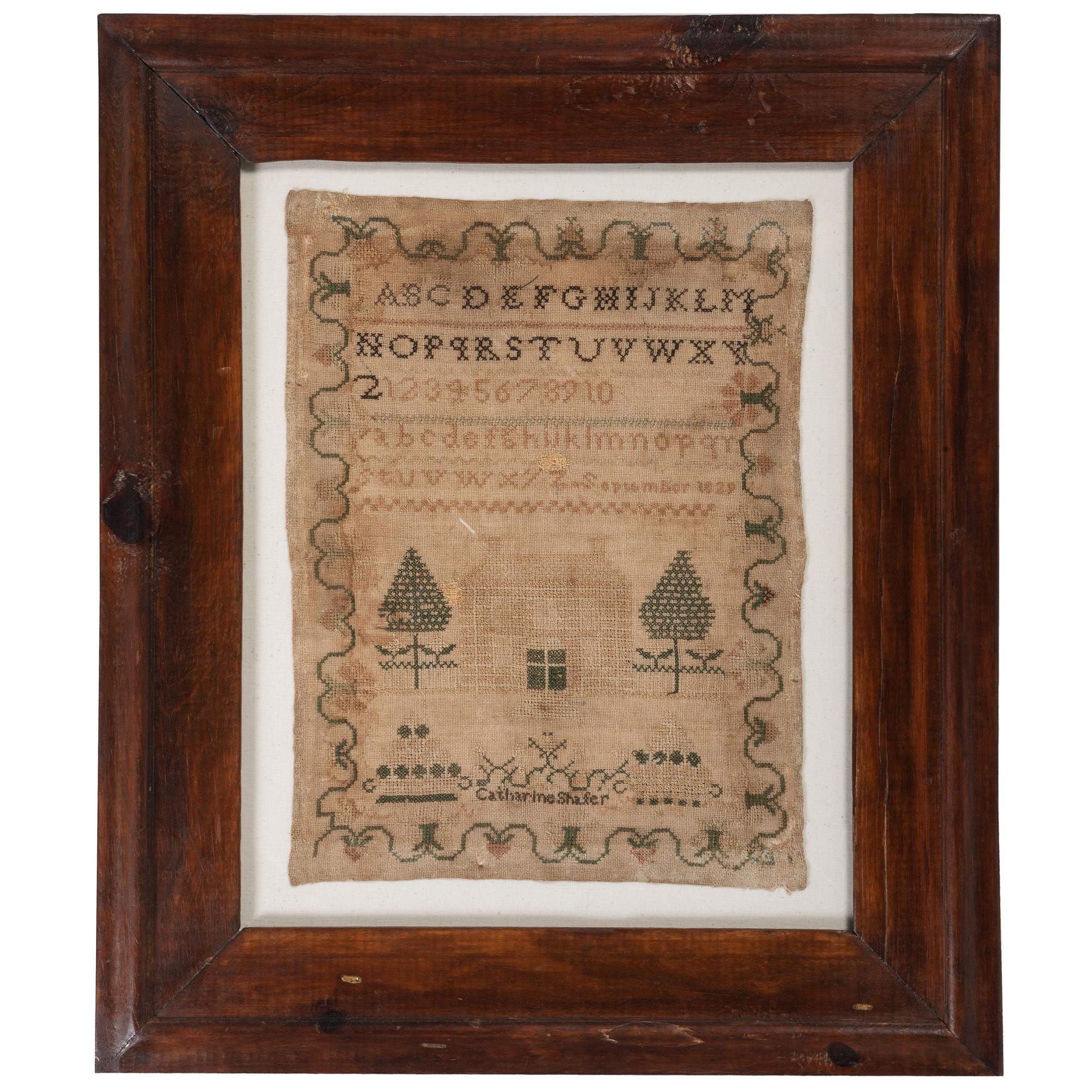 An Embroidered Needlework Alphabet Sampler, Signed Catharine Shafer