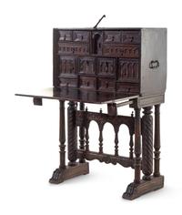 A Spanish Iron Mounted Carved Walnut Vargueño on Stand