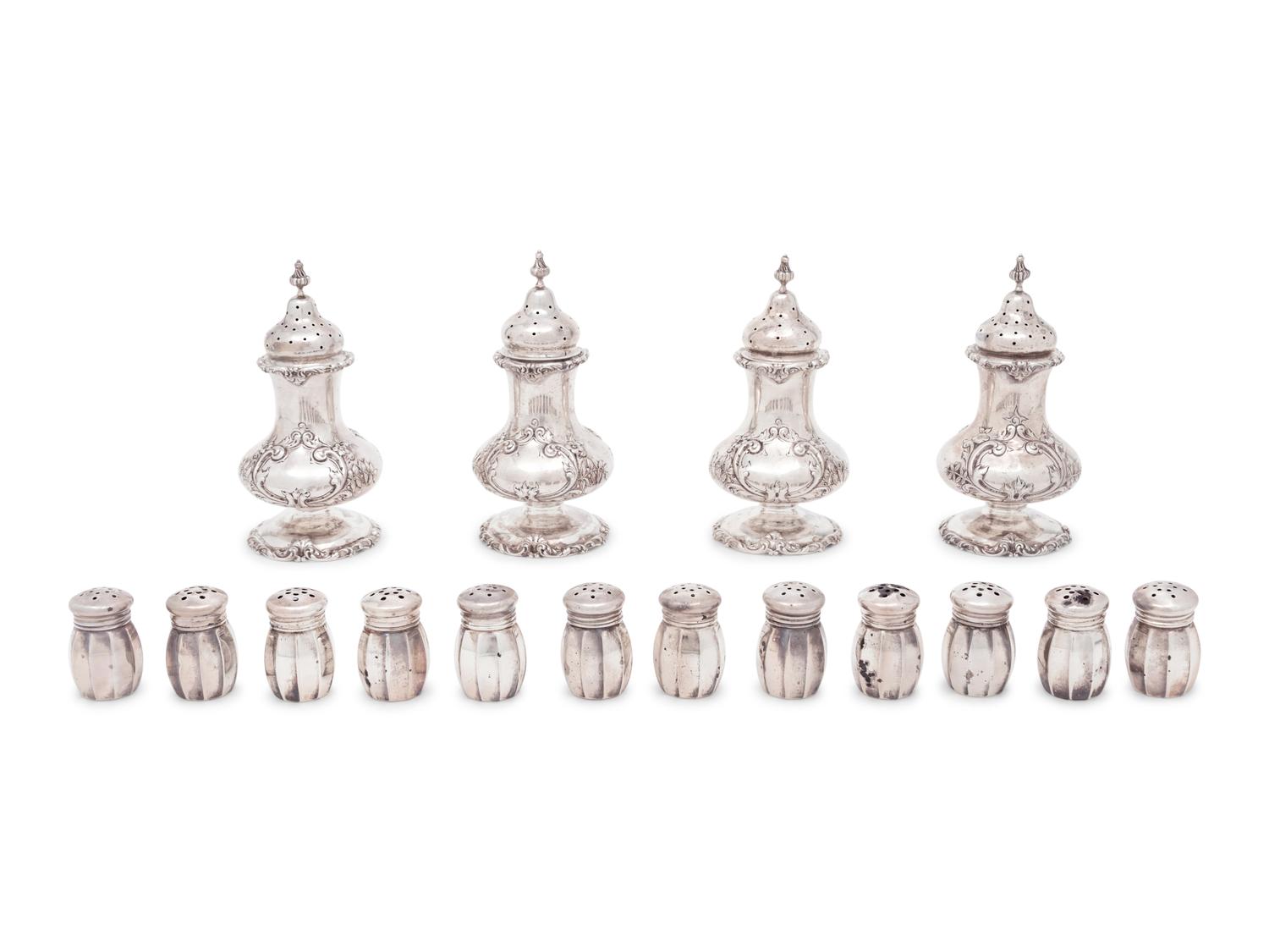 A Group of Sixteen Silver Casters