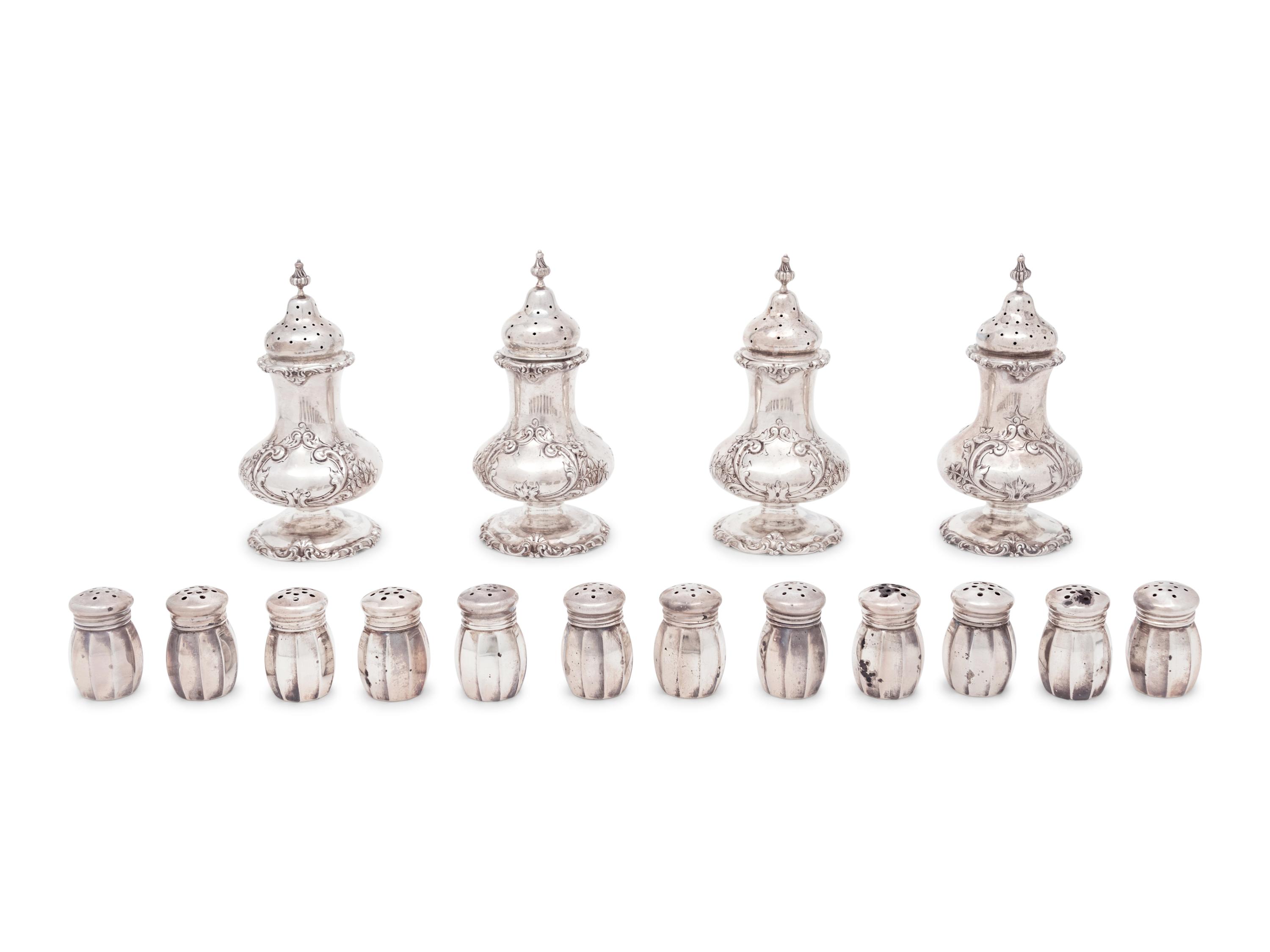 A Group of Sixteen Silver Casters