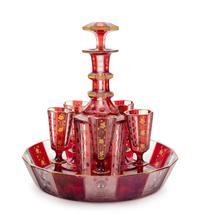 A Bohemian Gilt Decorated Ruby Cut-to-Clear Glass Liquor Set