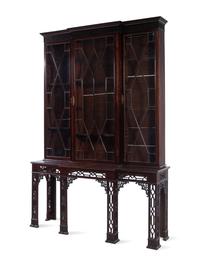 A Chinese Chippendale Pierce-Carved Mahogany Breakfront Bookcase on Stand