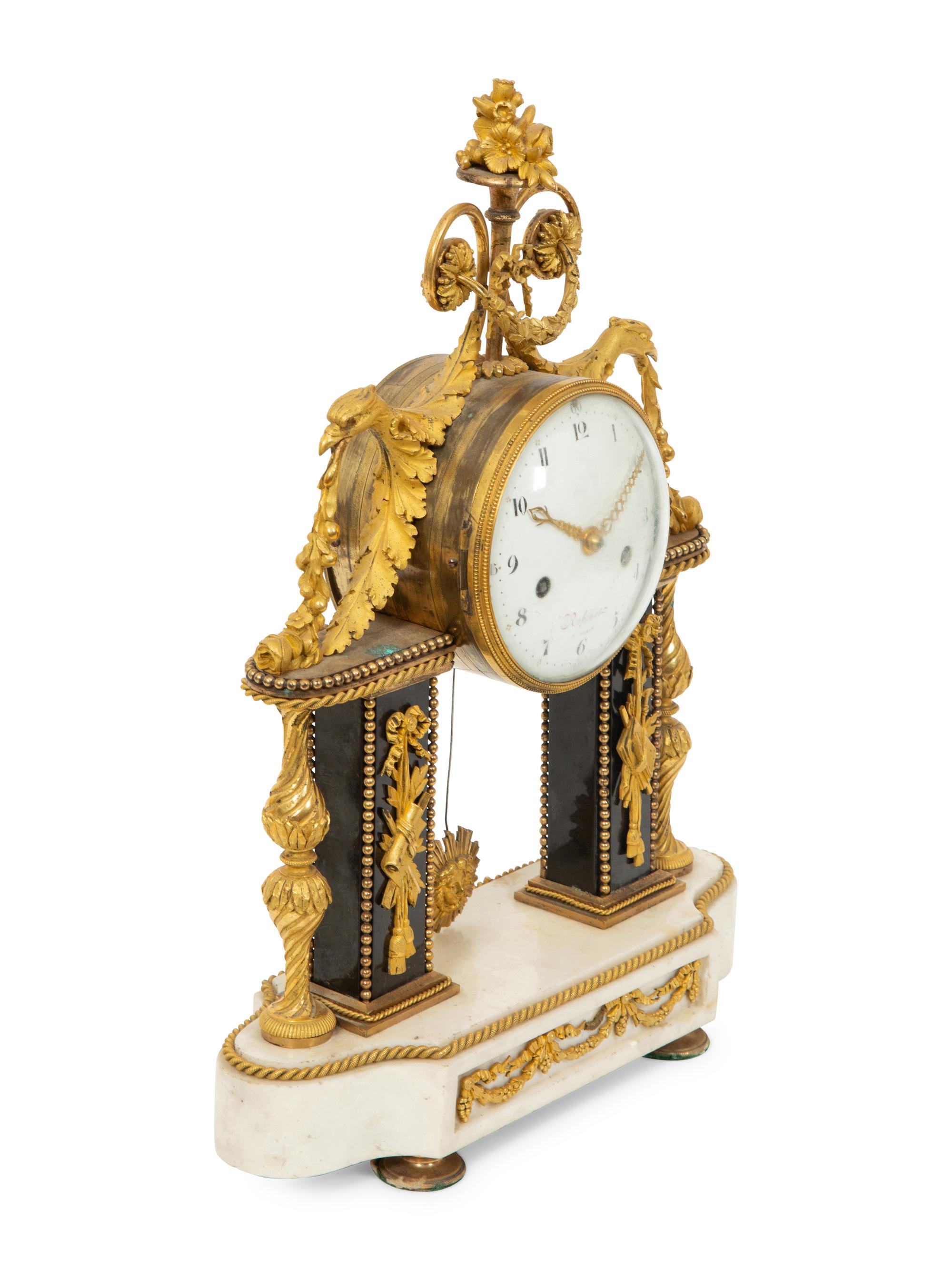 A Louis XVI Gilt Bronze and Marble Mantel Clock