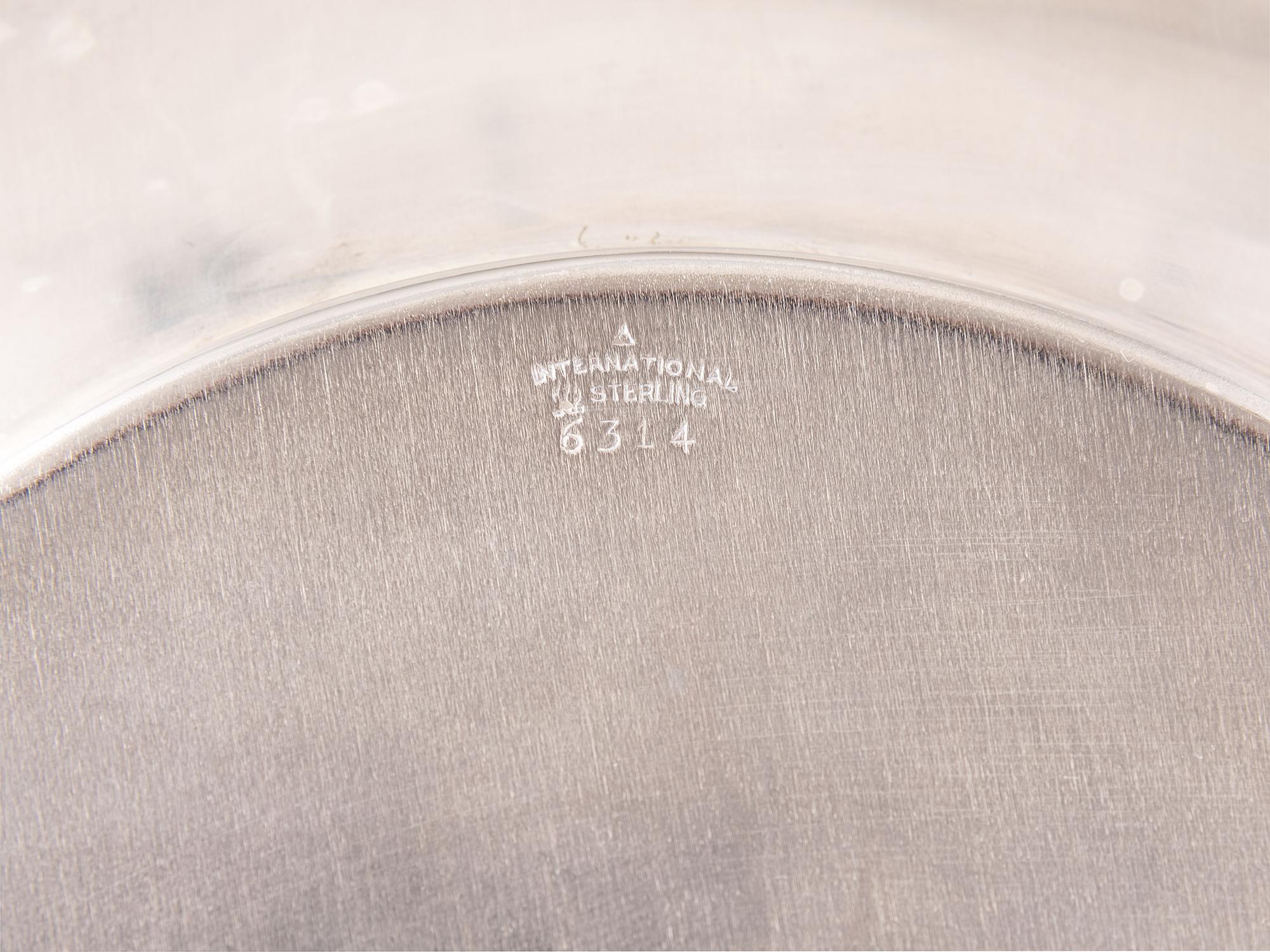 A Set of Twelve American Silver Bread Plates